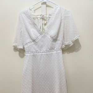 Short white dress brand unknown with tie in back